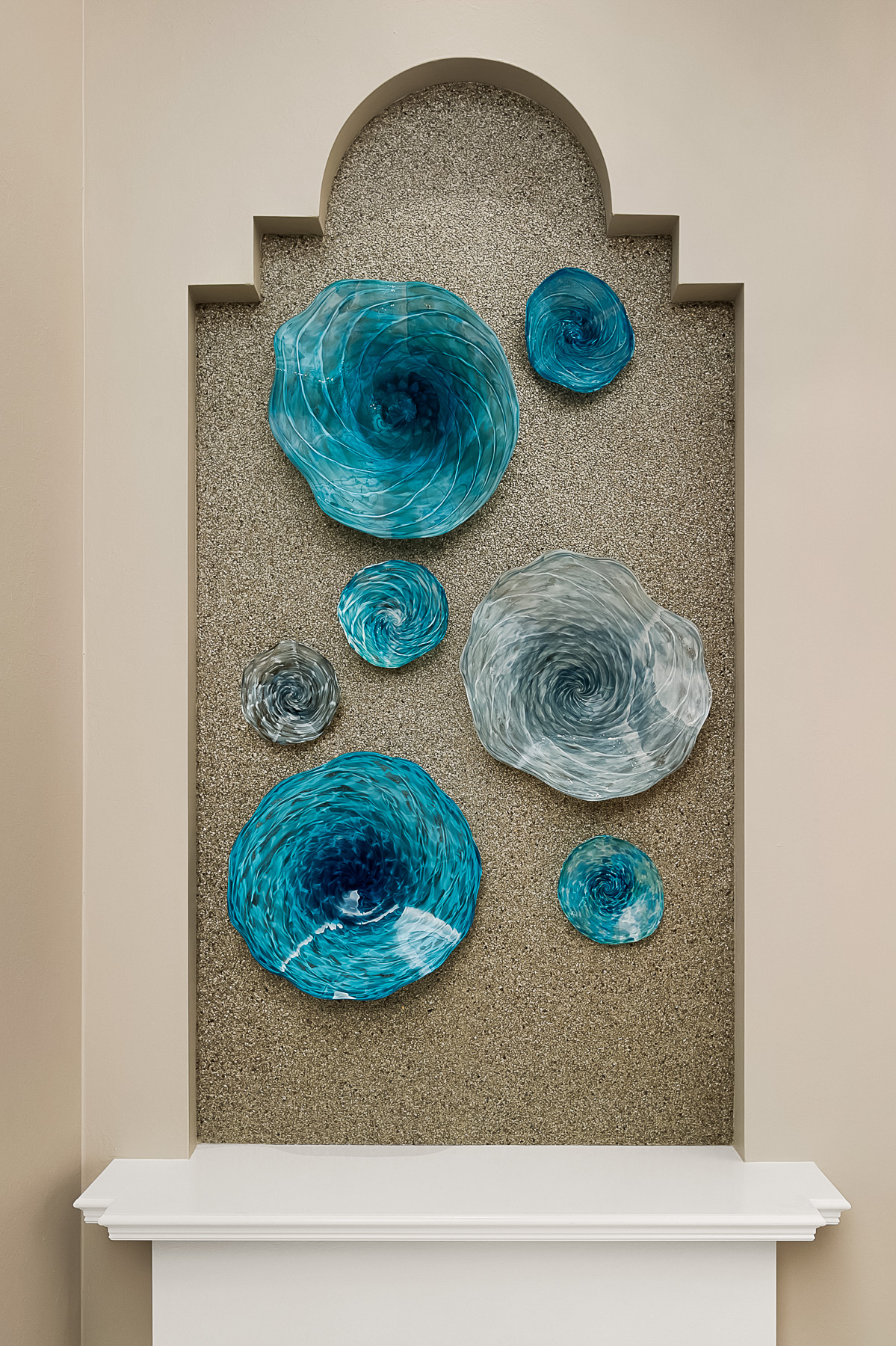 Niche art features hand blown glass bowls custom designed by a local artist