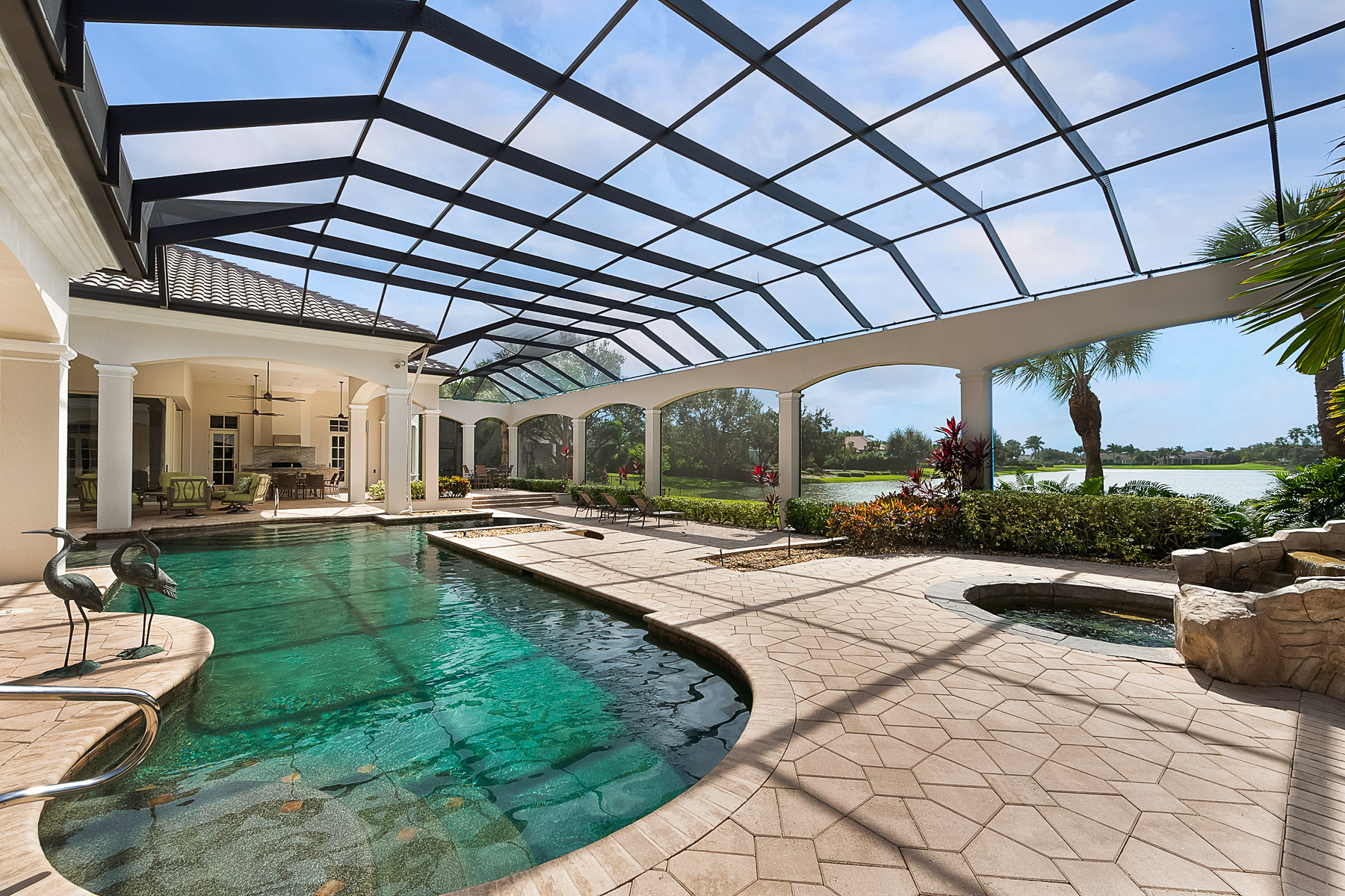 The outdoor kitchen and pool area are perfect for entertaining family and friends