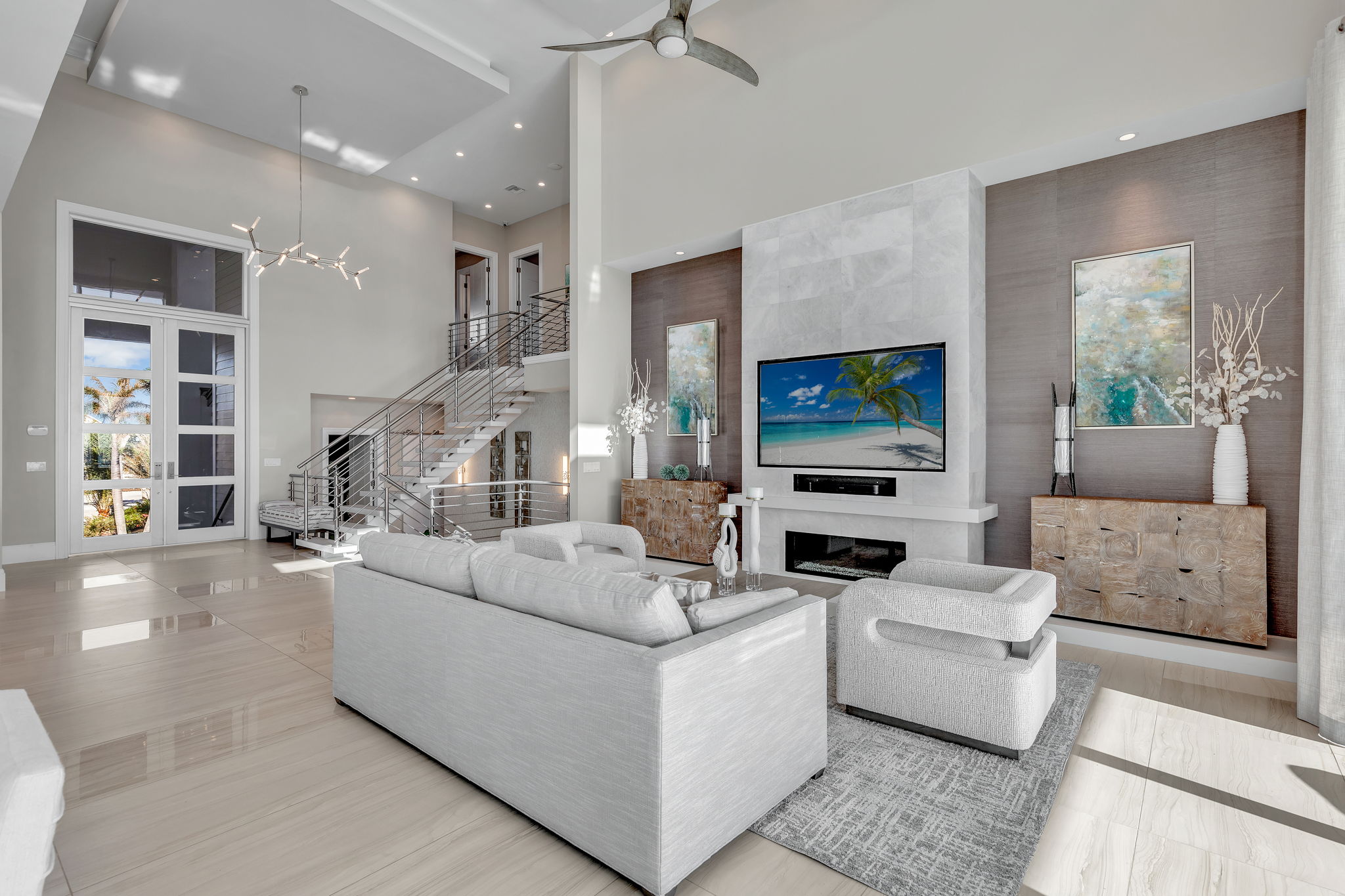 The walls, floors, and decor reflect the white sandy tones of Sanibel Beach.