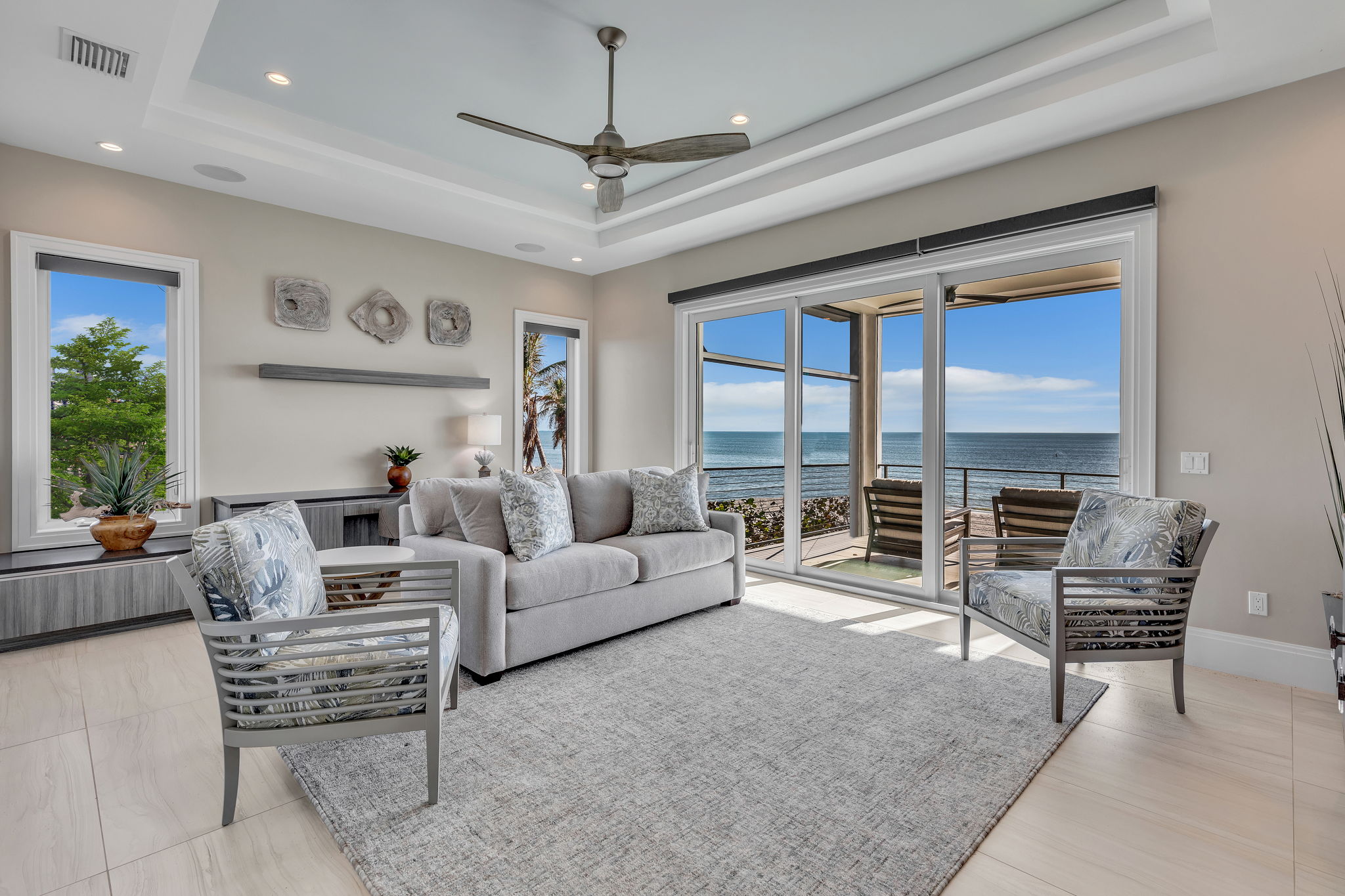 urniture upholstery blends white, gray, and sand tones with soft blues