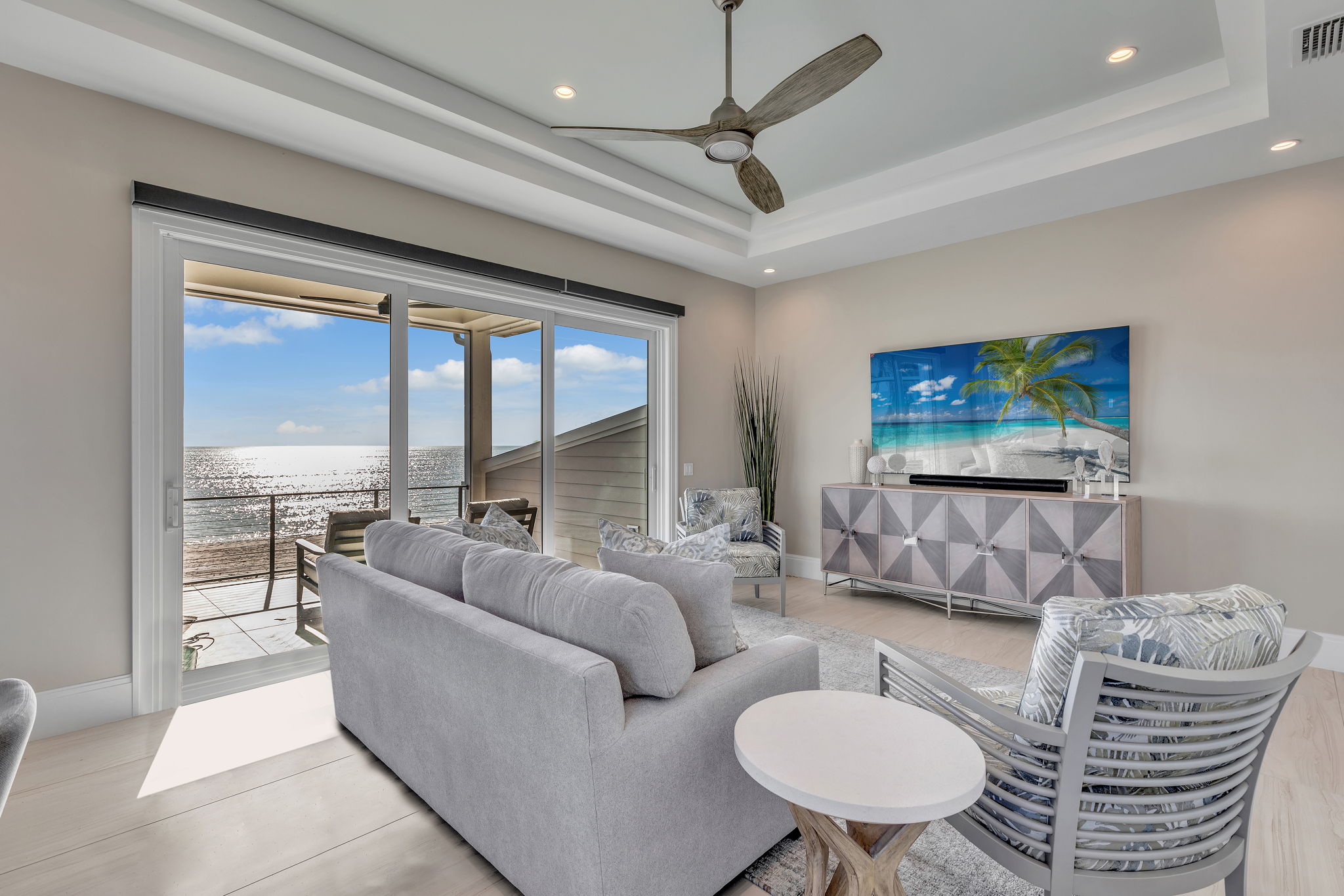 The ceiling fan and table base serve as weathered wood accents to the decor